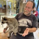 Larry Falkin with raccoon