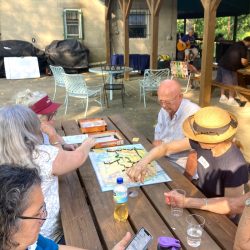 Picnickers enjoy eco-themed board games.